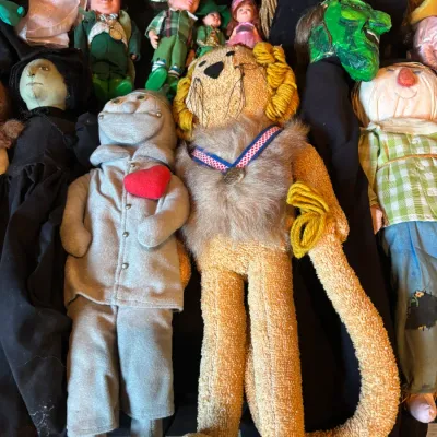 Sale Photo Thumbnail #117: Collection of vintage Wizard of Oz fabric and cloth dolls, featuring the Tin Man, Cowardly Lion, Scarecrow, and Wicked Witch of the West.