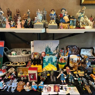 Large collection of vintage and modern Wizard of Oz memorabilia, including figurines, music boxes, books, dolls, and Christmas ornaments...