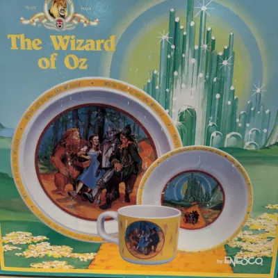 Vintage Enesco The Wizard of Oz three-piece children's dinnerware set in its original box, featuring a plate, bowl, and mug...