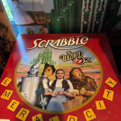The Wizard of Oz themed Scrabble board game in its original box, featuring artwork of the iconic movie characters.