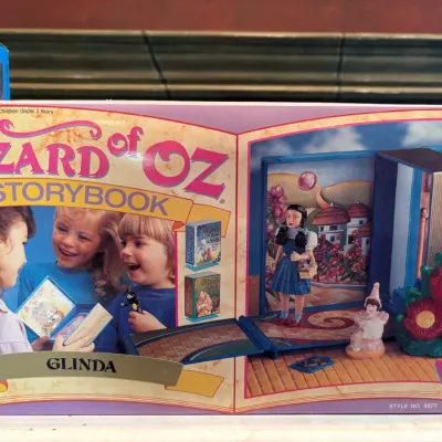 Vintage 1990s The Wizard of Oz Storybook playset, Style No. 8877, featuring Glinda and Dorothy figurines in original packaging.