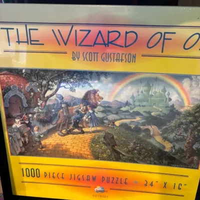 The Wizard of Oz 1000-piece jigsaw puzzle featuring artwork by Scott Gustafson, factory sealed in original box.