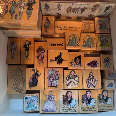Collection of vintage Wizard of Oz wood-mounted rubber stamps featuring iconic characters and quotes from the classic movie.