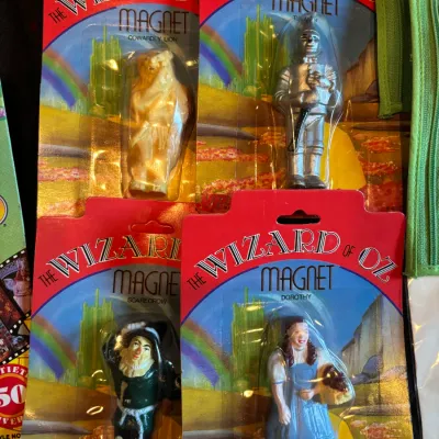 Sale Photo Thumbnail #112: Set of four vintage 'The Wizard of Oz' character magnets in original blister packaging, including Dorothy, Scarecrow, Tin Man, and Cowardly Lion.