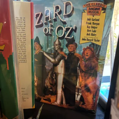The Wizard of Oz 50th Anniversary Edition book featuring the original script and songs, published circa 1989.