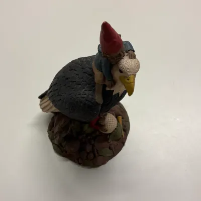 Tom Clark gnome figurine titled "Eagle" featuring a gnome riding a bald eagle over a golf ball base, dated 1980s.