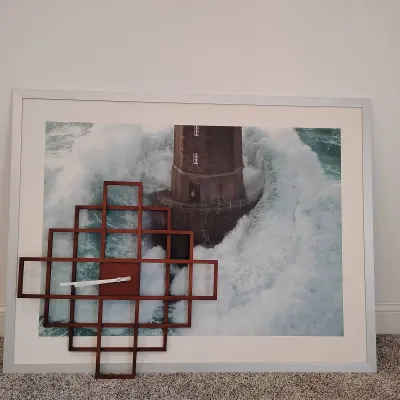 2-Piece Wall Decor Lot – Umbra Geometric Wall Clock & IKEA Framed Lighthouse Print