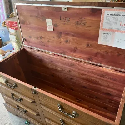 Vintage Lane cedar chest with faux drawer front design and original manufacturer paperwork on the lid interior.