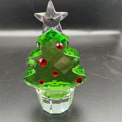 Sale Photo Thumbnail #4: Swarovski style faceted green crystal Christmas tree figurine featuring red crystal ornament accents and a clear star topper.