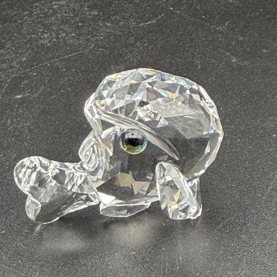 Sale Photo Thumbnail #47: Swarovski crystal miniature whale figurine featuring faceted detailing and dark green eyes.