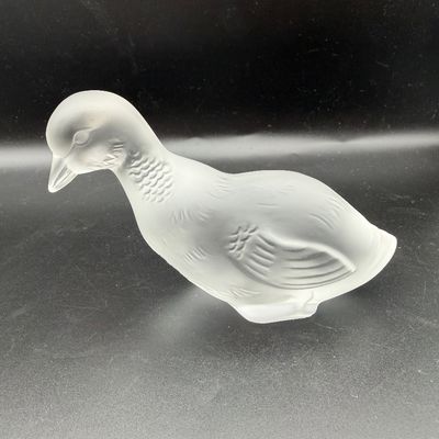 Sale Photo Thumbnail #55: Lalique frosted crystal duck figurine in a preening pose with molded feather details.