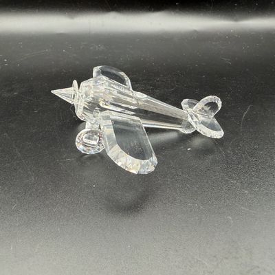Sale Photo Thumbnail #36: Swarovski crystal biplane figurine, featuring clear faceted lead crystal detailing and propellers.