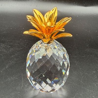 Sale Photo Thumbnail #49: Swarovski crystal pineapple figurine with gold-plated leafy crown.