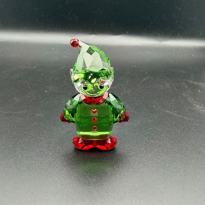 Sale Photo Thumbnail #14: Swarovski crystal Christmas elf figurine in green, red, and clear crystal.