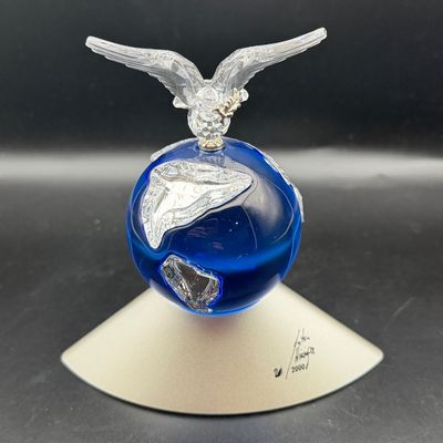 Sale Photo Thumbnail #35: Swarovski crystal 'Feathered Beauties' or millennium-themed globe figurine featuring a blue crystal sphere topped with a clear crystal dove on a silver-tone display base.