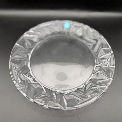 Sale Photo Thumbnail #54: Tiffany & Co. clear crystal plate featuring a wide textured, geometric-cut rim and smooth center dish.