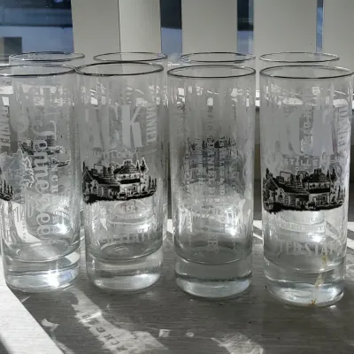 Set of six highball glasses featuring etched Jack Daniel's distillery graphic logos.