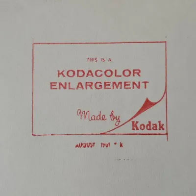 Back of a vintage photographic print stamped 'THIS IS A KODACOLOR ENLARGEMENT Made by Kodak,' date-stamped August 1961.