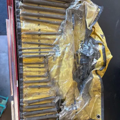 Vintage 25-piece hex key wrench set housed in a yellow and clear vinyl storage roll pouch.