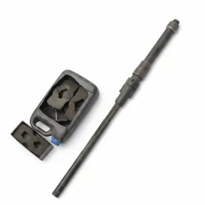 Vintage heavy-duty metal shaft tool alongside a plastic container holding various shaped rubber or foam inserts.