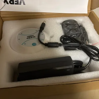 Very Crate brand electronics hub with power adapter supply and power cord in original foam-lined box.