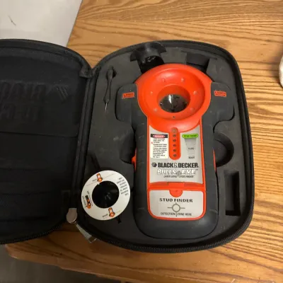 Black & Decker BullsEye auto-leveling laser level and stud finder, housed inside its original fitted black zippered case.