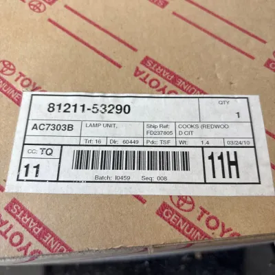 Toyota Genuine Parts box containing a lamp unit, part number 81211-53290.