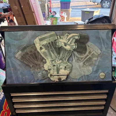 MAC Tools top chest toolbox featuring a V-twin motorcycle engine graphic on the lid and multi-drawer storage.