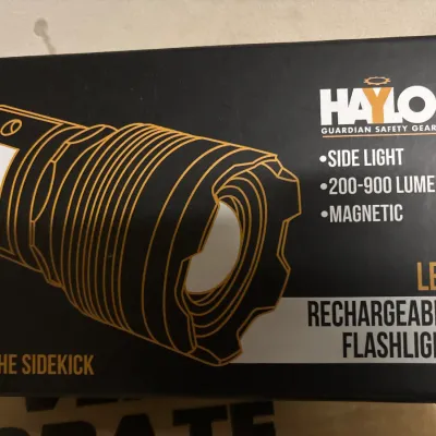 Haylo Guardian Safety Gear 'The Sidekick' LED rechargeable flashlight in its original box.