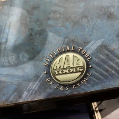 Mac Tools rolling tool chest featuring an 'Official Tool of S&S Cycle' emblem on the top surface.