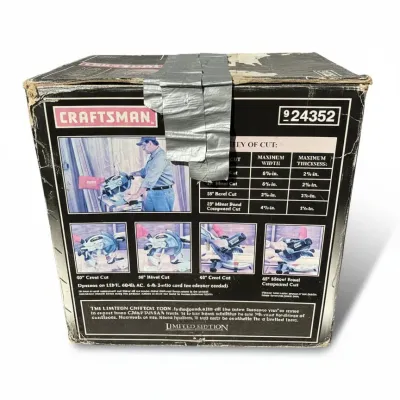 Craftsman miter saw in its original worn packaging, model number 924352, taped sealed with duct tape.