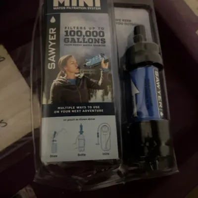 Sawyer Mini Water Filtration System, new in original clamshell packaging.