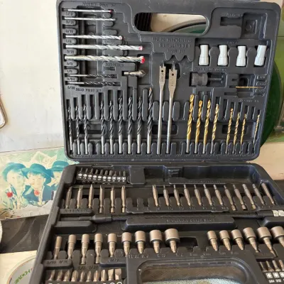 Comprehensive 112-piece screwdriving and drilling bit set in a black blow-molded storage case, featuring various drill bits, spade bits,...