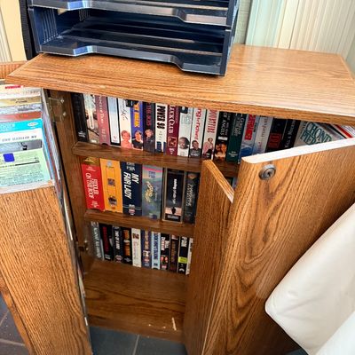 Sale Photo Thumbnail #163: Vintage VHS tapes and cabinet