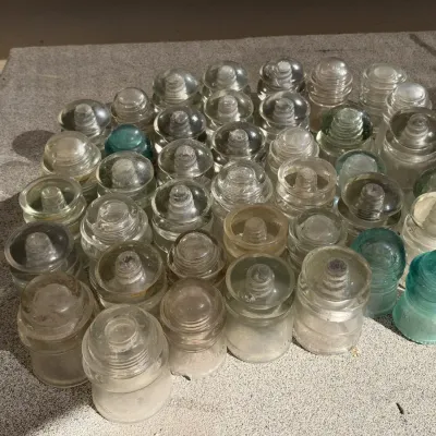 Large Lot Clear Glass Insulators with Aqua Teal and Amber Tint Pole Glass