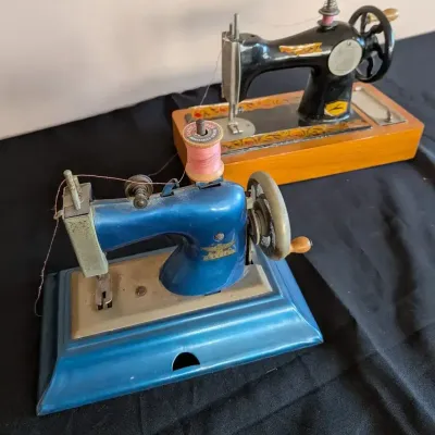 Charming Toy Hand Crank Sewing Machine Pair, Casige Blue and Belarus Wood Base