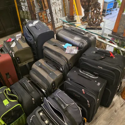 Sale Photo Thumbnail #44: Collection of modern softshell and hardshell rolling luggage, carry-on bags, and travel duffels in various colors and sizes.