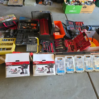 Sale Photo Thumbnail #139: Large assortment of power tools and hand tool sets, including Hyper Tough 20V project kits, drill bit sets, toolboxes, and various socket sets.