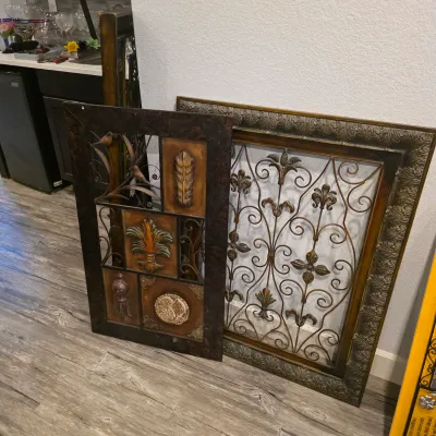 Sale Photo Thumbnail #31: Two large framed wall art pieces featuring decorative wrought iron scrollwork and ornate Tuscan-style motifs.