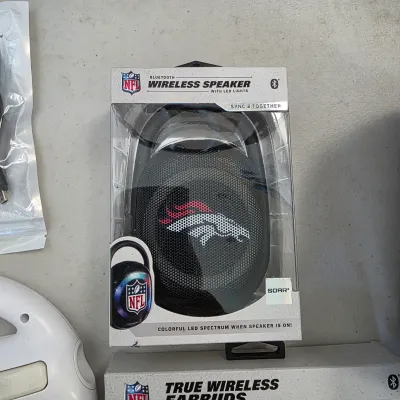 Sale Photo Thumbnail #155: NFL Denver Broncos Bluetooth wireless speaker by SOAR, packaged in its original box with LED light features.