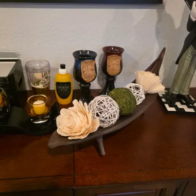 Sale Photo Thumbnail #11: Decorative wooden boat-shaped tray filled with woven spheres and wood flowers, displayed alongside Renaissance Festival goblets and glassware.