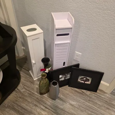 Sale Photo Thumbnail #41: Collection of home decor items including white wooden storage towers, decorative vases, and black-framed tree art prints.