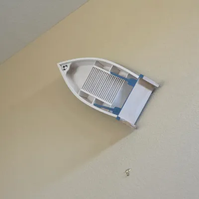 Sale Photo Thumbnail #111: Nautical-themed wooden rowboat wall shelf featuring blue and white paint details and slatted shelving.