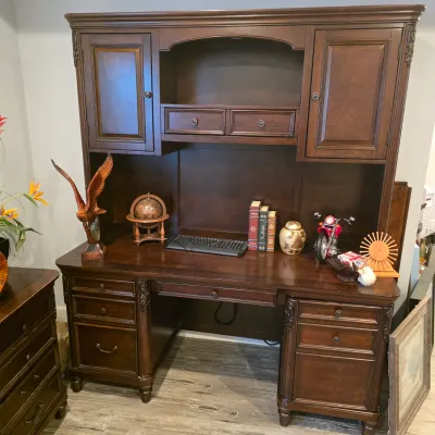 Sale Photo Thumbnail #36: Large dark stain wood executive desk with an attached upper hutch featuring cabinets, small drawers, and open shelving.