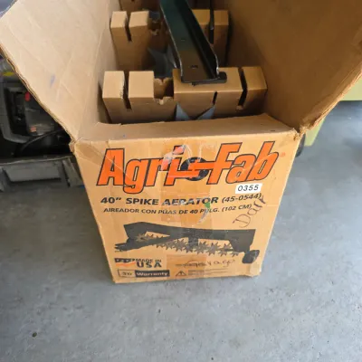 Sale Photo Thumbnail #144: Agri-Fab 40-inch spike aerator (model 45-0544) in original open cardboard box with inner packaging.