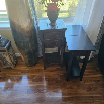 Sale Photo Thumbnail #105: Rustic dark wood accent side tables and a large decorative floor vase arranged near a window.