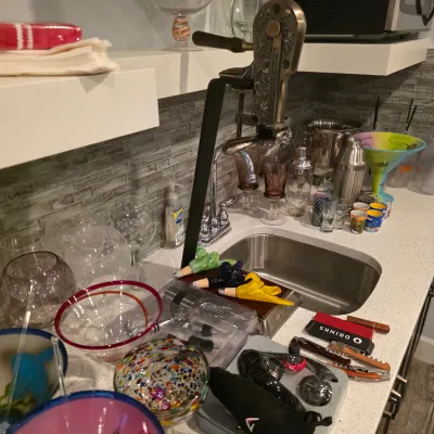 Sale Photo Thumbnail #29: Countertop barware collection featuring a Rogar counter-mount corkscrew opener alongside assorted glassware, shakers, and wine accessories.