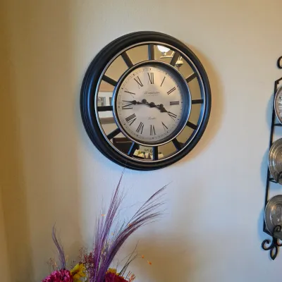 Sale Photo Thumbnail #68: Large Westminster Clock Company wall clock featuring a black and silver frame with mirrored accents and Roman numerals.