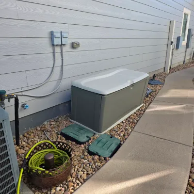 Sale Photo Thumbnail #166: Large grey resin outdoor storage box sitting alongside a house, accompanied by a bright green garden hose in a bronze-toned metal holder.