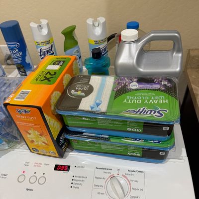 Sale Photo Thumbnail #117: Assorted household cleaning supplies including Swiffer Dusters, Swiffer Heavy Duty wet cloths, Lysol disinfectant sprays, and Sprayway glass cleaner.